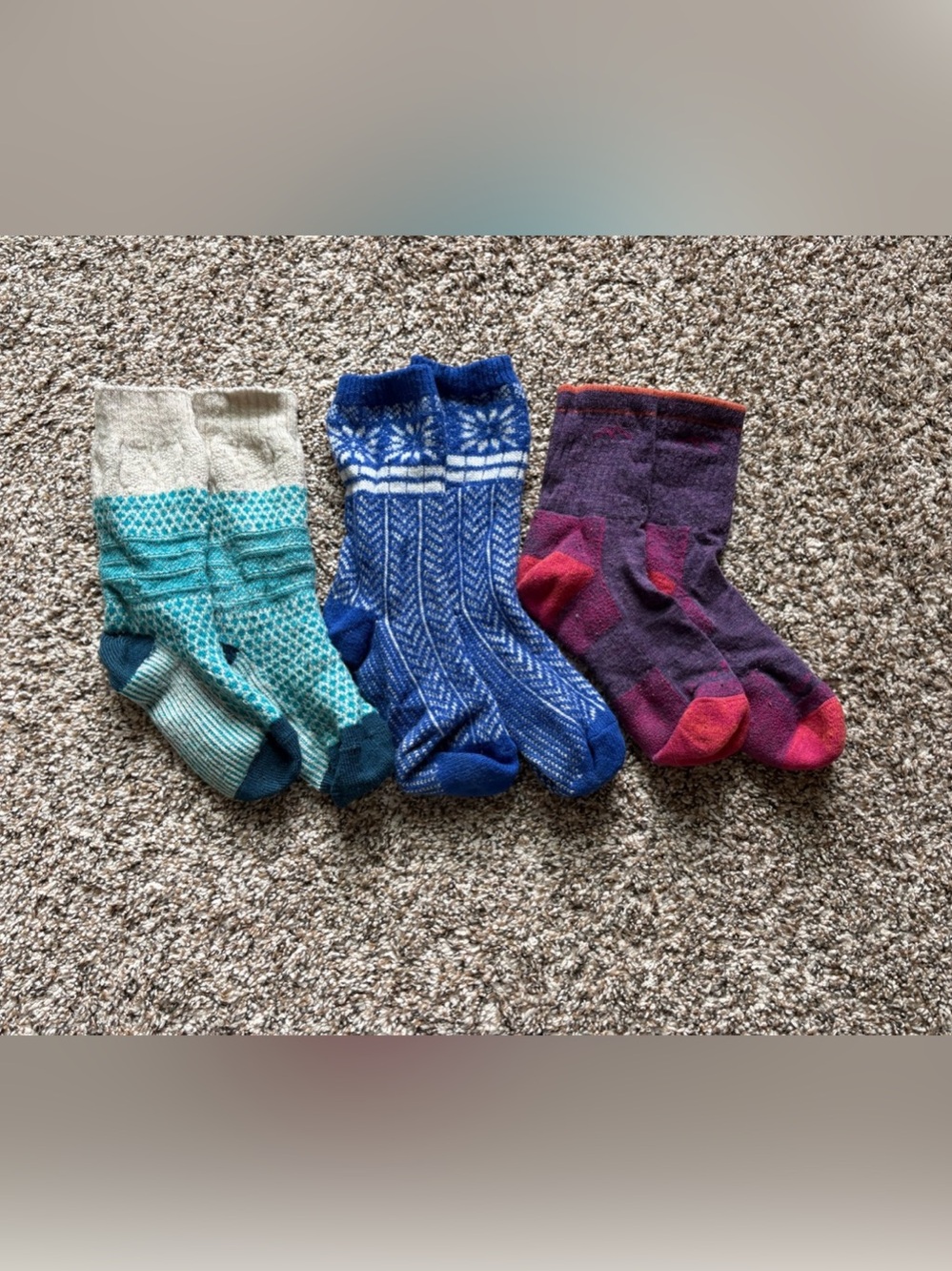 Three pairs of knit socks, smartwool and darn tough